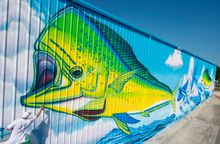 Artist David Dunleavy puts finishing touches on a huge mural entitled 
