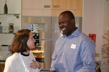 CEO of the Nevis Tourism Authority, Greg Philips chatting with SJ from Black Tomato as she prepares lunch with the team.