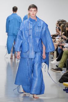 Dress of the Year 2015. Craig Green blue plastic quilted jacket and quilted trousers. Craig Green SS15