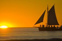 Ancient Pearl lugger at sunset off Cable Beach, Broome