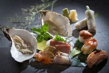 Assorted sushi sashimi, crab spring roll, french oysters