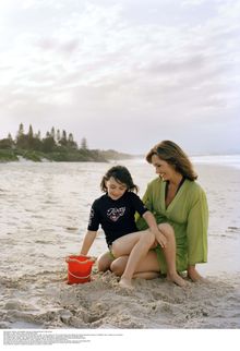Visitors playing with sand bucket at Belongil Beach