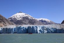 Zodiac cruising past a Dawes Glacier