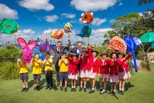Minister for Trade Tourism and Major Events Stuart Ayres and Minister for the Environment Mark Speakman with students from Queen