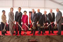 Prime Minister John Key and Fu Wah founder Madam Chan Laiwa break ground on the site of the Park Hyatt Auckland.