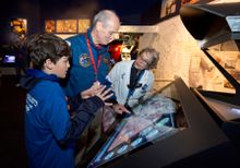 New Cosmic Quest. Elijah Huyck, astronaut Norman Thaggard and educator Beverly Rother experiencing the new Cosmic Quest. 