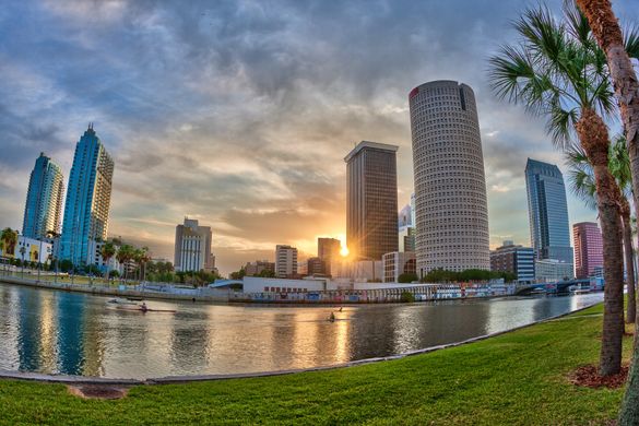 Dawn breaks over downtown Tampa as rowers ply the Hillsborough River