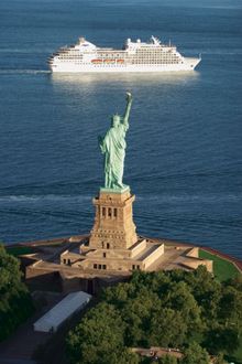 Regent Seven Seas ship by Statue of Liberty.  