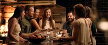 A group enjoys dinner at QT's Capitol Bar & Grill during the High-Energy inspired movie trailer. 