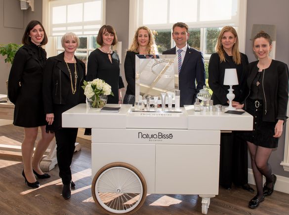Chewton Glen Managing Director Andrew Stembridge, Spa Director Kerry Hudson (centre) and the Natura Bisse team lined up and read