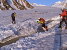 Crossing the glacial meltwater in Mongolia's western Altai mountains