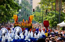 Aloha festivals parade going down Kalakaua Avenue 