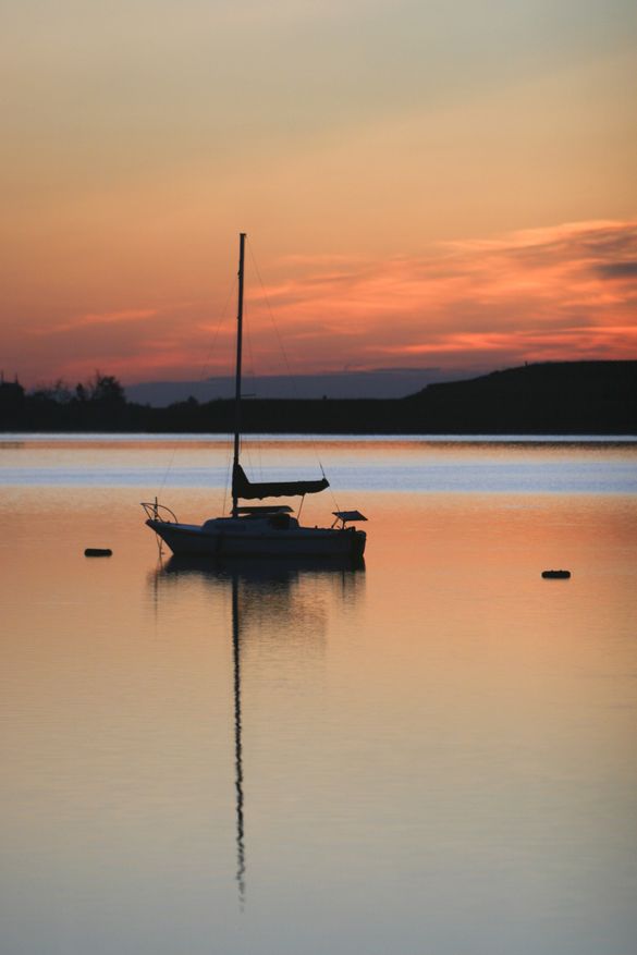 A sailboat at sunset on Boulder Reservoir 