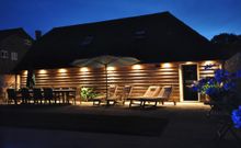 Spacious, well-lit poolside seating area 