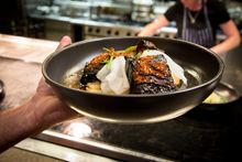 Sit by the fireplaces at Monster Kitchen and Bar and enjoy an award-winning menu that charts the seasons .