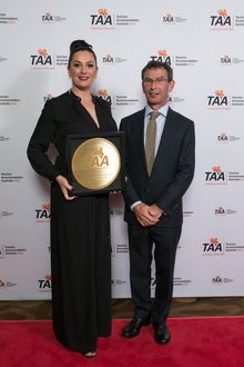 Atura Dandenong General Manager Lisa Parker accepts the award for Outstanding Community Service and Achievement from award spons