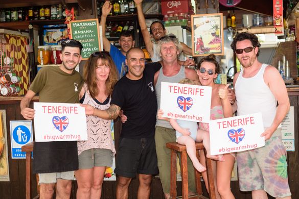 A group of British tourists share a group hug with their Tenerife friends!
