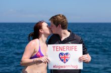 One young couple on holiday spreading the love with more than just a hug!