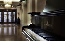 An antique Steinway graces the lobby at Sofitel Queenstown Hotel & Spa