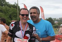 Former Olympian, Daley Thompson, with a Tri St Lucia competitor