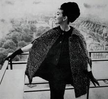 Model wearing a fashionable three piece by Jack Clark for Country Life Magazine 1963