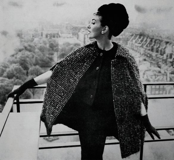 Model wearing a fashionable three piece by Jack Clark for Country Life Magazine 1963