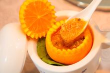 Dishes such as roe crab meat stuffed in an orange showcased Hangzhou’s traditional cuisine. 