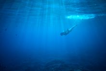 Snorkelling the crystal clear waters around the Island