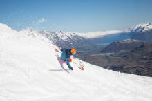 Skiing at Coronet Peak with Queenstown in the background. Credit: Neil Kerr