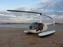 A Scenic Helicopters Robinson R44 four-seater light helicopter