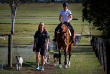 Enjoying the relaxing lifestyle of the Gold Coast Hinterland, Glynis Nunn-Cearns takes an early morning walk with her daughter Jess, a show jumps rider, and the family dogs.