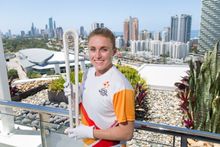 Gold Coast 2018 Commonwealth Games ambassador and former world champion sprint hurdler Sally Pearson with the GC2018 Queen's Baton.
