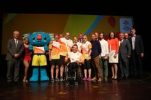 Para-athlete and GC2018 ambassador Kurt Fearnley proudly holds the Queen's Baton for a group shot, including Queensland Premier Annastacia Palaszczuk, after the unveiling of the cutting-edge design on November 20, 2016 - 500 Day to Go to the Opening Cerem