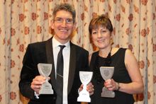 Directors of Coast & Country Cottages, Andrew and Karen Jones, with the three winning trophies.