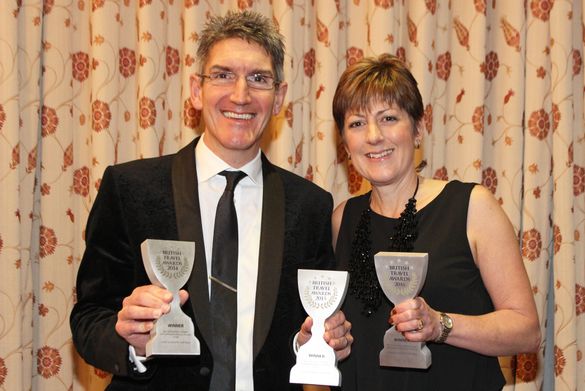 Directors of Coast & Country Cottages, Andrew and Karen Jones, with the three winning trophies.