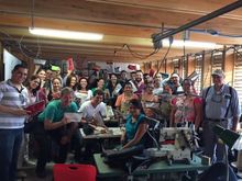 The Cayuga Management Team on a recent visit to a project that supports employment for underprivileged women who manufacture purses.