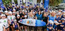 Sally Pearson with her GC2018 surfboard after being named as a Gold Coast 2018 Commonwealth Games ambassador.