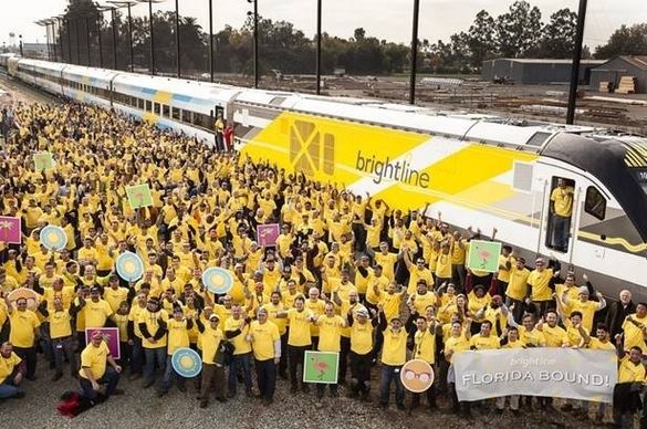 Siemens employees celebrate as the first Brightline trainset is completed.