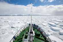 Polar Pioneer sailing through pack ice in Antarctica