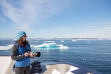 Photographer on board Polar Pioneer, Antarctica