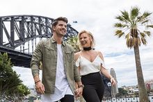 Sydney to Me musicians Jess Dunbar and Matt Price at Dawes Point, in front of Sydney Harbour Bridge. Credit Destination NSW