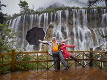 Ken Duncan on location in front of falls in Jiuzhaigou in China