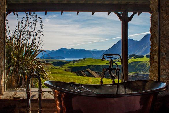 A bath with a view – soak up the scenery from Mahu Whenua Ridgeline Homestead & Eco Sanctuary near Queenstown. 