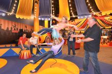 Family balancing act on the lyra rings at the world's largest children's museum