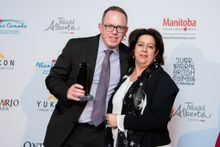 Stuart Forster (Go Eat Do)  2017 Past  Winner of Best Online Canada Coverage presented with Trophy bear by Nim Singh, Destination Canada 