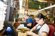Cuban masters still roll cigars by hand in Tampa Bay's Ybor City neighborhood as they have for 130 years.