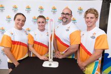 Australian athletes (from left) Kristina Clonan, Sally Pearson, Damon Kelly and Ryan Fisher with the baton, which is made of materials including macadamia nut timber and recycled plastic. 