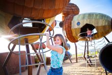 National Arboretum Canberra's Pod Playground is a popular spot for kids to hang out during school holidays.