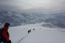 Teammates climbing Mount Halgurd in the Zagros mountains in Iraqi Kurdistan on an adventure travel expedition with Secret Compass