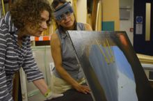Curator of Historic Art at Norwich Castle, Giorgia Bottinelli (left) and conservator, Alice Tavares da Silva, examine Magritte’s La Condition Humaine